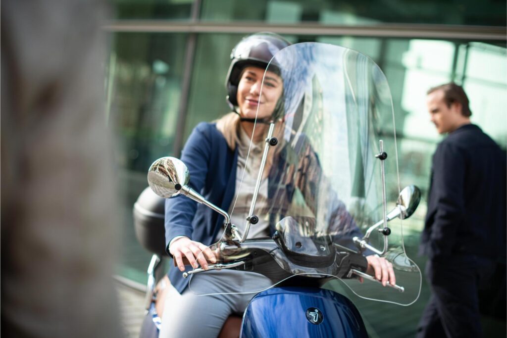 Segway e Scooter E125S Lifestyle Girl standing and smiling front view